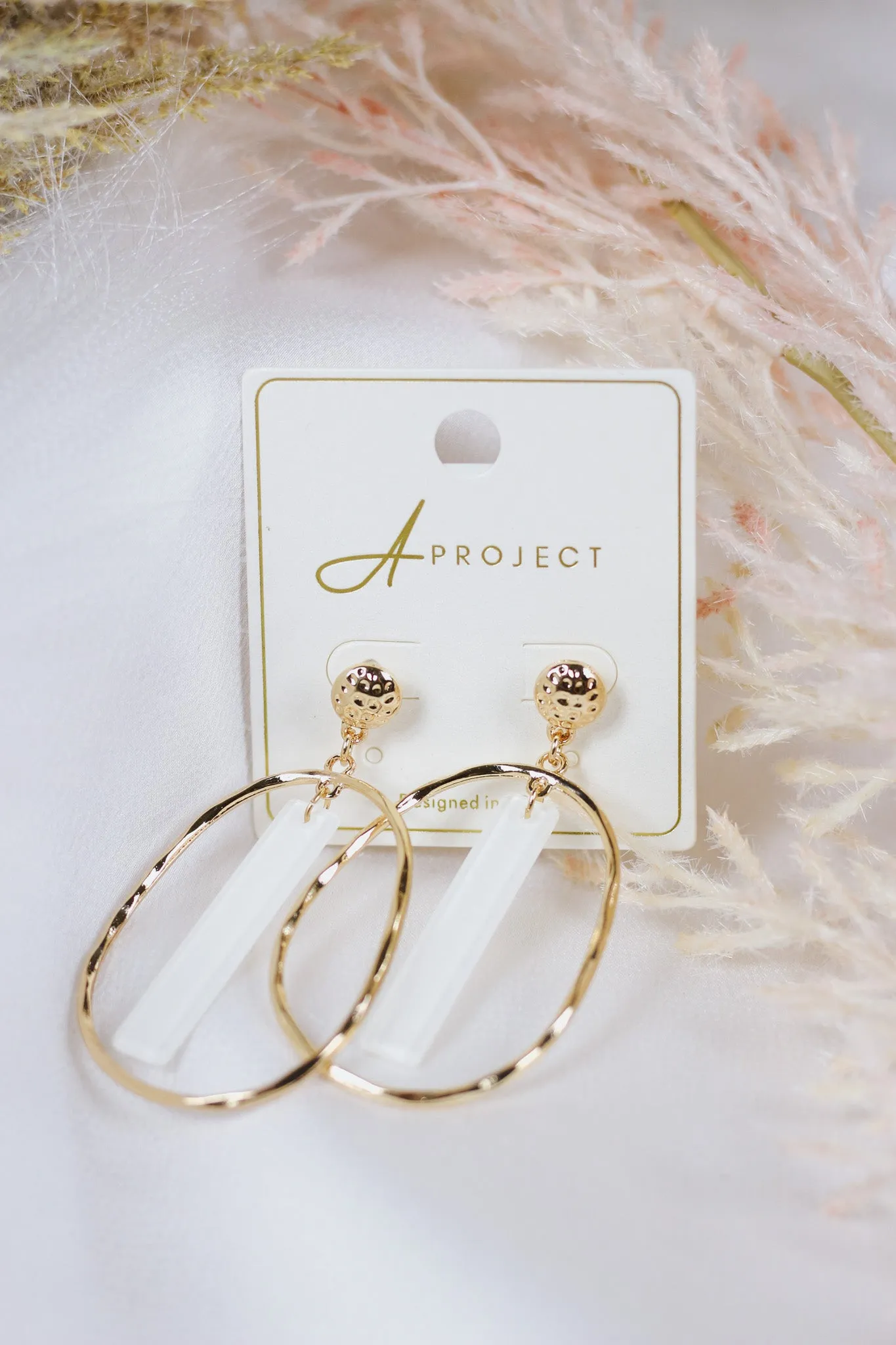 Gold Open Oval with White Acrylic Bar 2" Earring