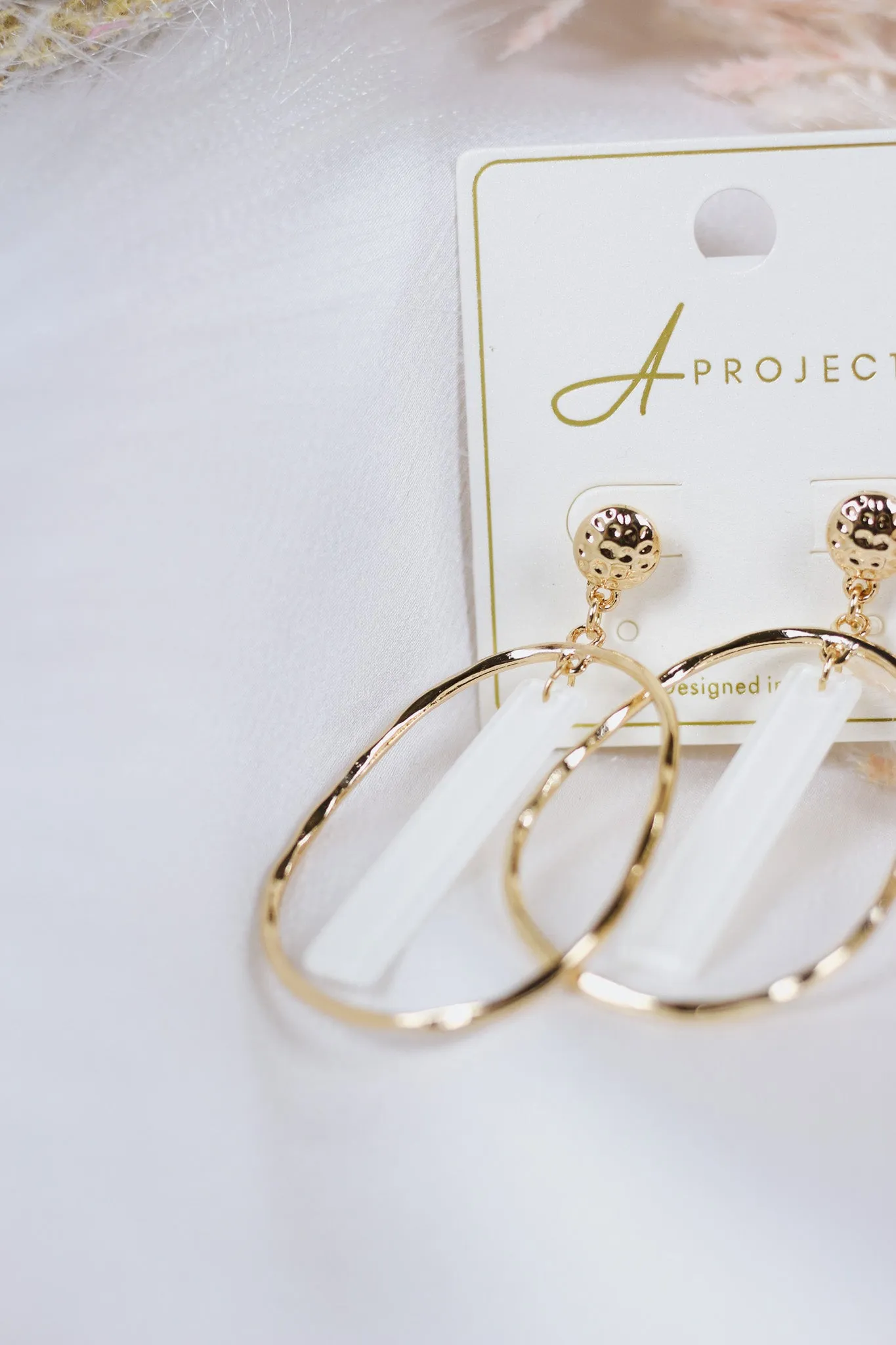 Gold Open Oval with White Acrylic Bar 2" Earring