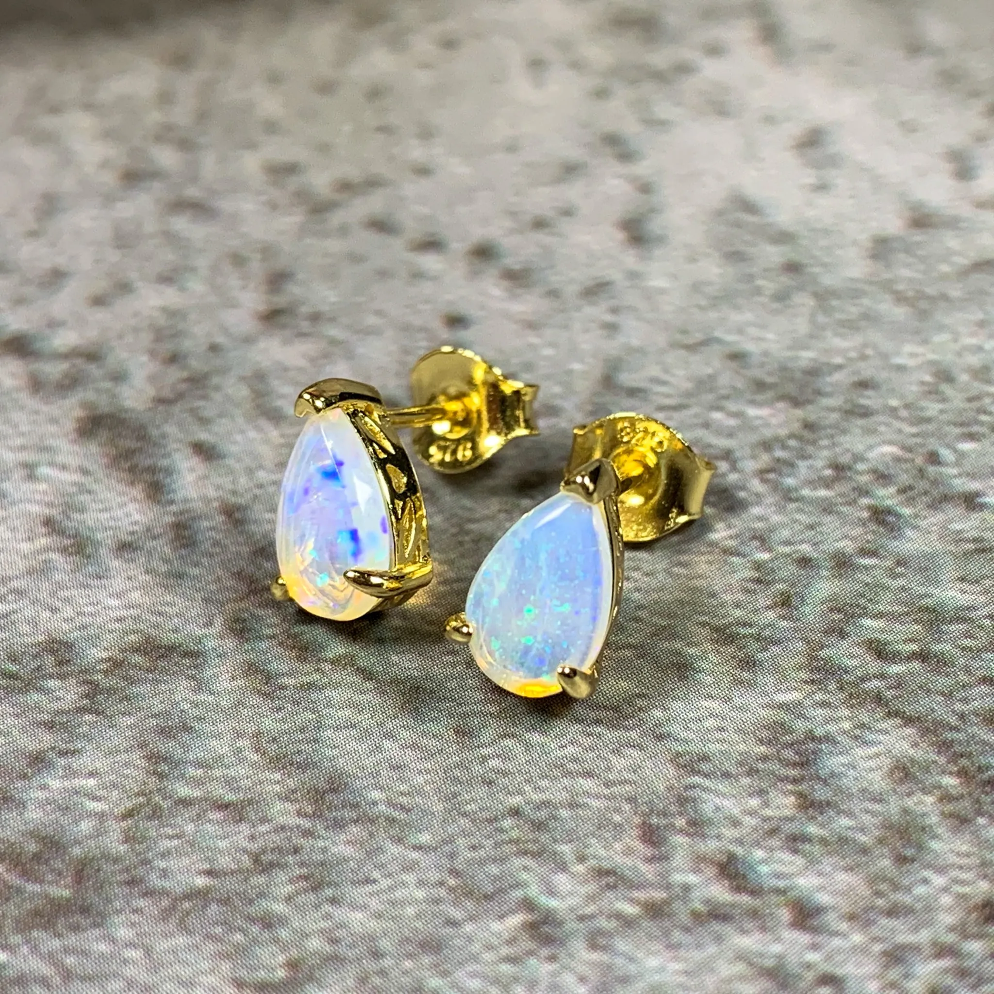 Gold plated silver 8x5mm pearshape White Opal studs