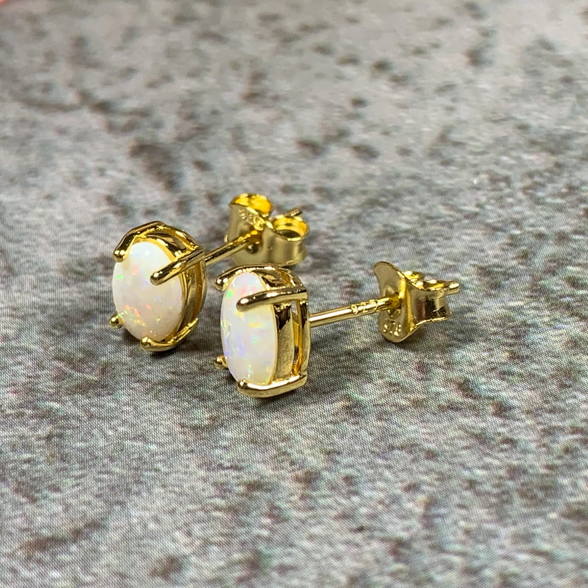 Pair of Gold plated silver 7x5mm White Opal studs