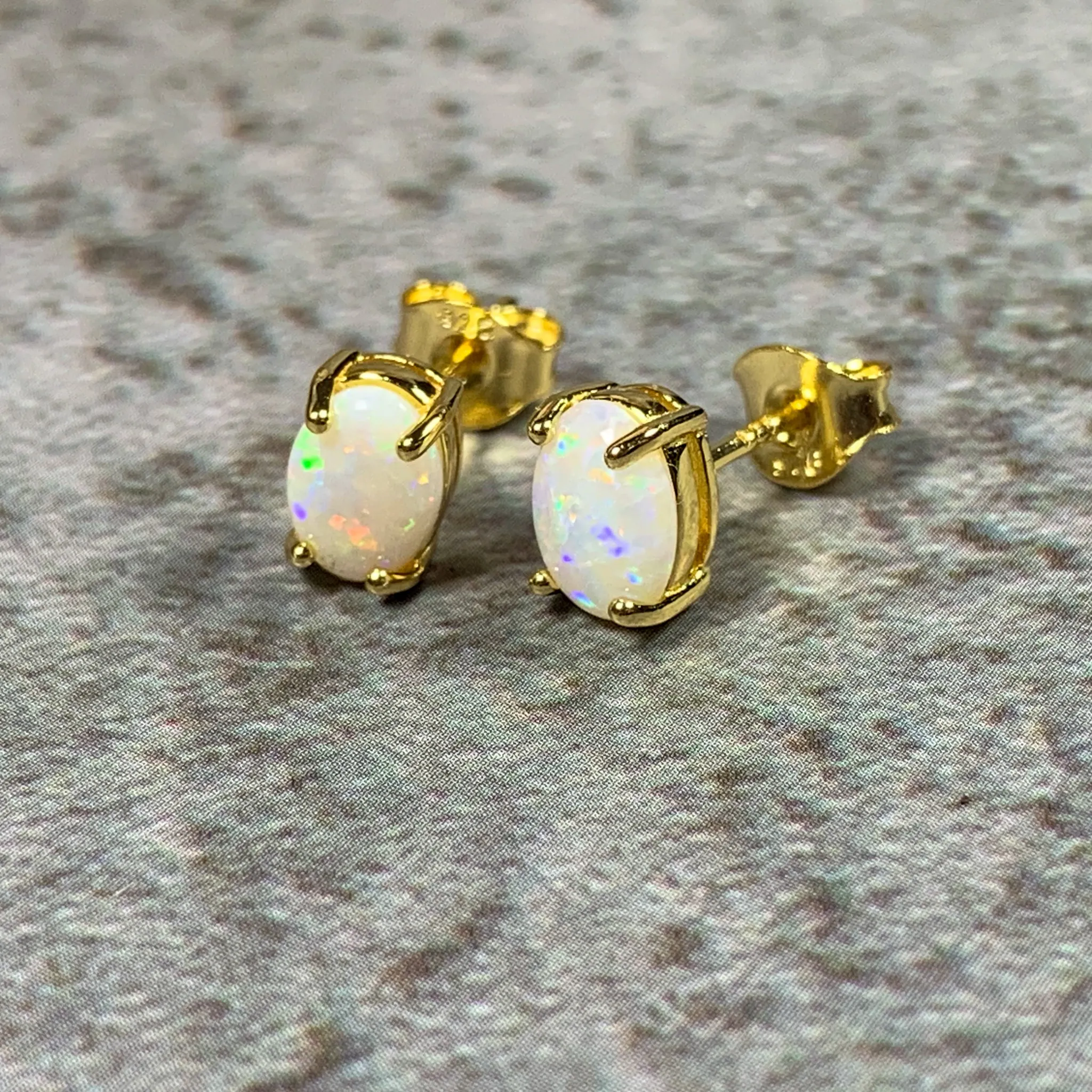 Pair of Gold plated silver 7x5mm White Opal studs
